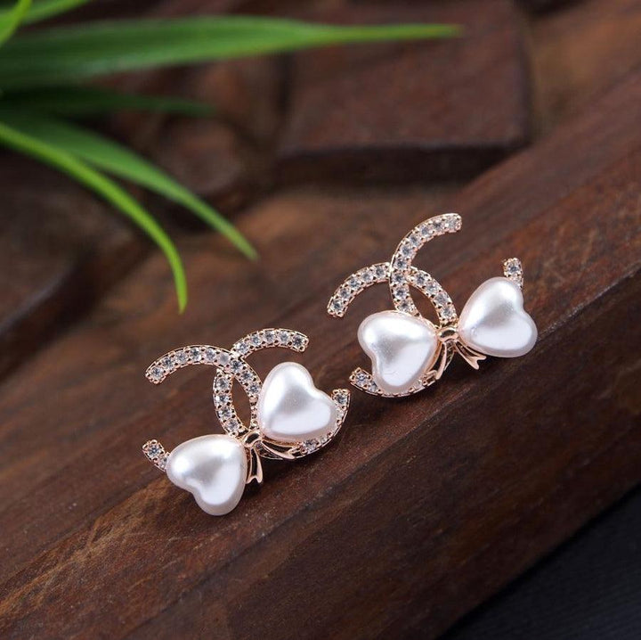 Korean Gold/ Silver/Rosegold Plated Bow Knot Design Fancy Stud Earring- KRNER 3643 - Trendisia