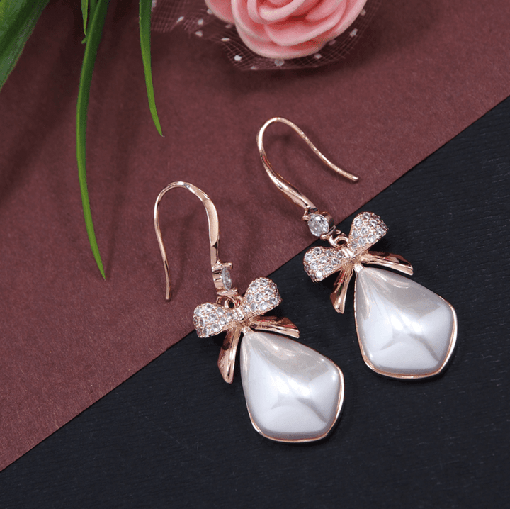 Korean Gold/Silver/Rosegold Plated Geometrical Shaped BowKnot Drop Earring- KRNER 3662 - Trendisia